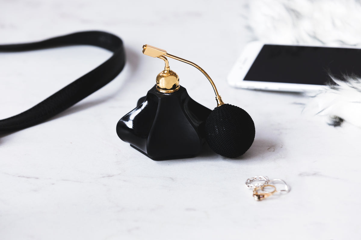Amber Noir perfume bottle on a vanity table